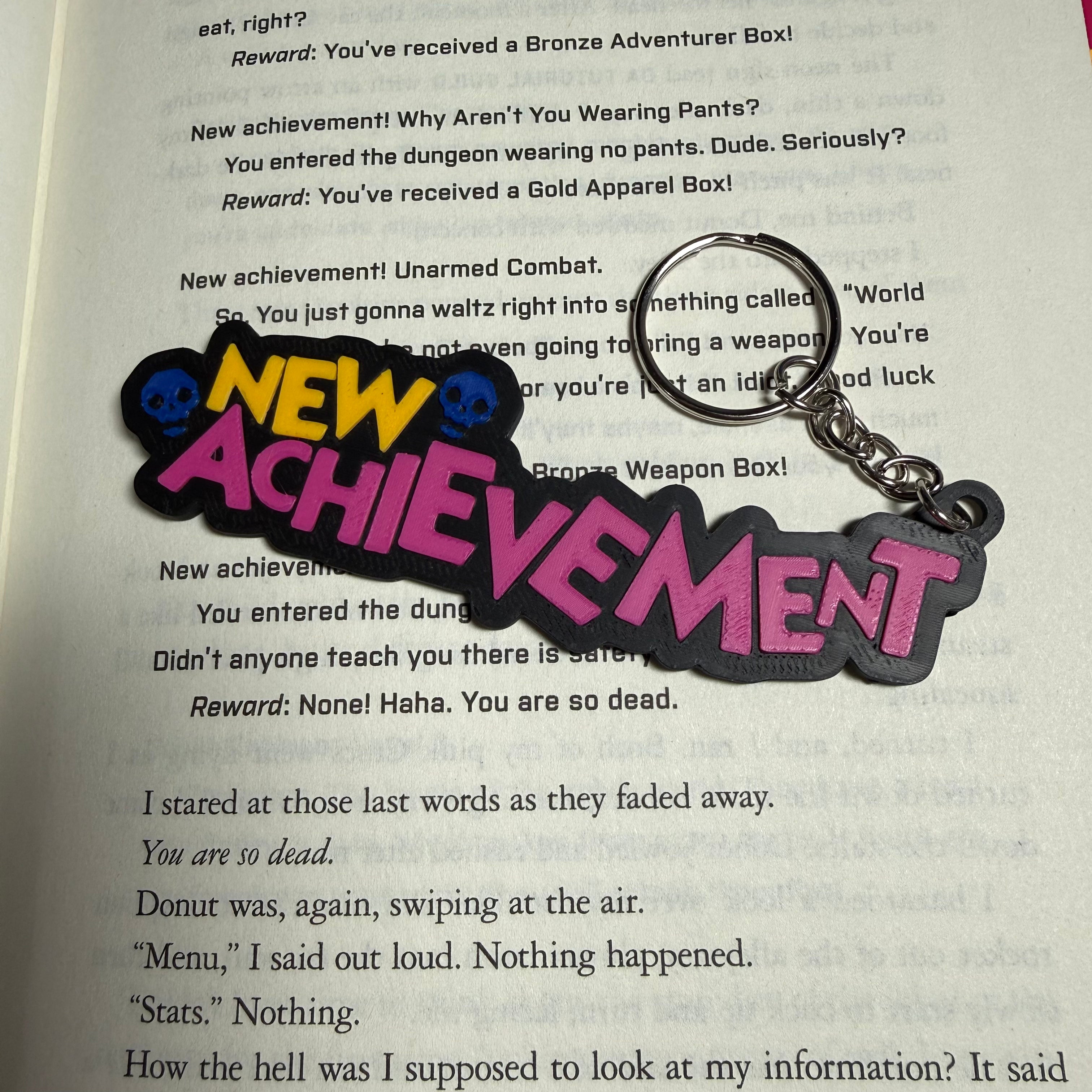 DCC Inspired "NEW ACHIEVEMENT" Keychain | Dungeon Crawler Fan Gift | 3D Printed Gamer Accessory | RPG Book Lover Keychain